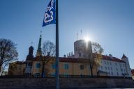 Flag to mark the 20th anniversary of Latvias accession to the EU, behind it Riga Castle, seat of the Latvian President, Riga, Latvia