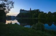 Hohenzollern Castle Sigmaringen, former princely residence and administrative seat of the Princes of Hohenzollern-Sigmaringen, city castle, architecture, historical building, west view, morning mood, light mood, reflection in the water, Danube, 
