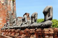 Row of ruin buddha statue in wat chai wattanaram, ayutthaya