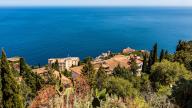 Taormina on a rock terrace on the slope of Monte Tauro, Taormina, Sicily, Italy