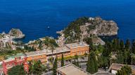 View of Mazzaro with Isola Bella, Lido of Taormina, Taormina on a rock terrace on the slope of Monte Tauro, Taormina, Sicily, Italy