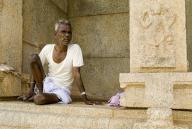 An old man sitting in Ramachandra temple in Hampi, Karnataka, South India, India, Asia. UNESCO World Heritage Site