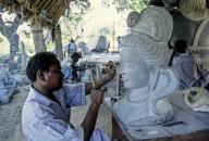 A stone sculptor at work in Mahabalipuram Mamallapuram near Chennai, Tamil Nadu, South India, India