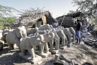 Stone sculptor with Elephant figures, Shop in Mahabalipuram Mamallapuram near Chennai, Tamil Nadu, South India, India