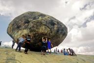 A perfectly balanced huge boulder resting on slender rock-base known as Krishna\'s butter ball in Mahabalipuram Mamallapuram near Chennai, Tamil Nadu, South India, India, Asia. UNESCO World Heritage Site