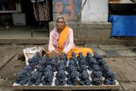 An old woman selling grapes near City Market in Bengaluru Bangalore, Karnataka, South India, India