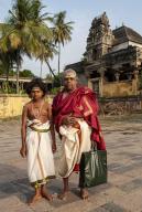 Priest standing with his son in Thillai Nataraja temple in Chidambaram, Tamil Nadu, South India, India