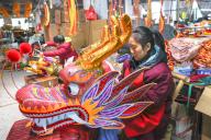 **CHINESE MAINLAND, HONG KONG, MACAU AND TAIWAN OUT** Workers make dragon-shaped lanterns in a workshop in Nanchang City, east China
