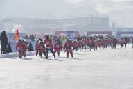 Racers compete in the skating competition during the first China Jilin Songhua River Ice Skating Marathon in Jingyu County, Baishan City, northeast China