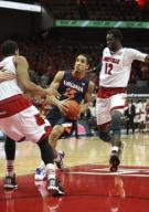 07 March 2015: Virginia Cavaliers guard Malcolm Brogdon (15) drives to the basket against Louisville Cardinals forward/center Mangok Mathiang (12) in a game between the University of Virginia Cavaliers and the University of Louisville Cardinals in ...