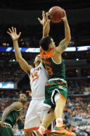 11 March 2016: Miami Hurricanes guard Angel Rodriguez (13) rebounds the ball from Virginia Cavaliers guard Malcolm Brogdon (15) in the semifinal of the ACC Tournament at the Verizon Center in Washington, D.C. (Photograph by Mark Goldman/Icon ...