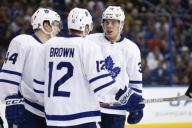TAMPA, FL - DECEMBER 29: Toronto Maple Leafs center Auston Matthews (34) talks to Toronto Maple Leafs defenseman Morgan Rielly (44) and Toronto Maple Leafs right wing Connor Brown (12) during the NHL game between the Toronto Maple Leafs and the ...