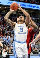WASHINGTON, DC - MARCH 16: North Carolina Tar Heels forward Armando Bacot (5) shoots against the North Carolina State Wolfpack in the ACC Tournament Championship on March 16, 2024 at the Capital One Arena in Washington, D.C. (Photo by Mark Goldman/Icon Sportswire