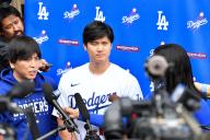LOS ANGELES, CA - FEBRUARY 03: Los Angeles Dodgers designated hitter Shohei Ohtani (17) is interviewed and his interpreter Ippei Mizuhara looks on during DodgerFest at Dodger Stadium on February 03, 2024 in Los Angeles, California. (Photo by Brian Rothmuller/Icon Sportswire