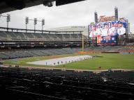 DETROIT, MI - APRIL 17: TheDetroit Tigers grounds crew remove the rain tarp from the field before a regular season Major League Baseball game between the Texas Rangers and the Detroit Tigers on April 17, 2024 at Comerica Park in Detroit, Michigan. (Photo by Joseph Weiser\/Icon Sportswire
