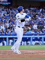 LOS ANGELES, CA - MAY 04: Los Angeles Dodgers designated hitter Shohei Ohtani (17) hits a single during an MLB baseball game against the Atlanta Braves played on May 4, 2024 at Dodger Stadium in Los Angeles, CA. (Photo by John Cordes\/Icon Sportswire