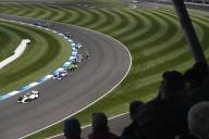 INDIANAPOLIS, IN - MAY 11: Fans look on as cars race through turn fourteen during the NTT IndyCar Series Sonsio Grand Prix on May 11, 2024, at the Indianapolis Motor Speedway Road Course in Indianapolis, Indiana. (Photo by Michael Allio/Icon Sportswire