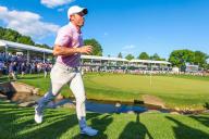 CHARLOTTE, NC - MAY 12: Rory McIlroy runs to the club house after winning the final round of the Wells Fargo Championship at Quail Hollow Club on May 12, 2024 in Charlotte, North Carolina. (Photo by David Jensen/Icon Sportswire