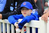ATLANTA, GA - MAY 13: A young fan waits for a possible autograph during batting practice before the Monday evening MLB game between the Chicago Cubs and the Atlanta Braves on May 13, 2024 at Truist Park in Atlanta, Georgia. (Photo by David J. Griffin/Icon Sportswire