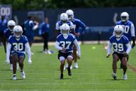 INDIANAPOLIS, IN - MAY 11: Indianapolis Colts cornerback Jaylin Simpson (30), Indianapolis Colts cornerback Kwinton Lassiter (37) and Indianapolis Colts cornerback Claiborne Fields (39) run through a drill during the Indianapolis Colts rookie camp practice on May 11, 2024 at the Indiana Farm Bureau Football Center in Indianapolis, IN. (Photo by Zach Bolinger/Icon Sportswire