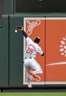 BALTIMORE, MD - May 15: Baltimore Orioles right fielder Anthony Santander (25) cannot catch up to hard hit line drive during the Toronto Blue Jays versus the Baltimore Orioles on May 15, 2024 at Oriole Park at Camden Yards in Baltimore, MD. (Photo by Mark Goldman/Icon Sportswire