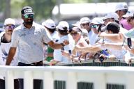 LOUISVILLE, KY - MAY 19: Sahith Theegala gives a fist bump to a fan as he walks to the No. 2 tee box during the final round of the PGA Championship, May 19, 2024, at Valhalla Golf Club in Louisville, Kentucky. (Photo by Matthew Maxey/Icon Sportswire