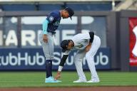 BRONX, NY - MAY 20: Juan Soto #22 of the New York Yankees admires the Adidas cleats of Julio RodrÃ­guez #44 of the Seattle Mariners prior to the game on May 20, 2024 at Yankee Stadium in the Bronx, New York. (Photo by Rich Graessle\/Icon Sportswire