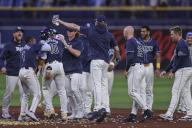 St. Petersburg, FL: The Tampa Bay Rays celebrate Tampa second baseman Amed Rosario (10) on is winning hit after an MLB game against the Los Angeles Angels on April 16, 2024 at Tropicana Field. The Rays beat the Angels in thirteen innings 7-6. (Kim Hukari/Image of Sport