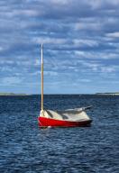 Red sailboat anchored in Chatham Harbor, Cape Cod, Massachusetts, USA