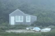 Charming fishing shack cottage in morning mist