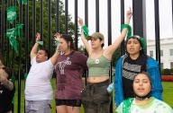 Abortion rights activists marched to the White House in Washington D.C. on July 9, 2022 to stage a mass sit-n. Green bandanas decorated the White House fence, while some demonstrators used the bandanas to physically fasten themselves to the steel structure. (Photo by Jeff Malet