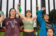 Abortion rights activists marched to the White House in Washington D.C. on July 9, 2022 to stage a mass sit-n. Green bandanas decorated the White House fence, while some demonstrators used the bandanas to physically fasten themselves to the steel structure. (Photo by Jeff Malet