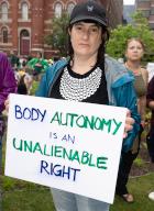 "Body Autonomy is an Unalienable Right" reads her sign. Abortion rights activists marched to the White House in Washington D.C. on July 9, 2022 to stage a mass sit-in. (Photo by Jeff Malet