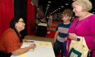 Donna Barba Higuera signs her book âThe Last Cuentistaâ for Patti Sabik of Ashburn Va. and her nephew Sean. At the Library of Congress National Book Festival on Saturday, September 3, 2022 at the Walter E. Washington Convention Center in Washington D.C. (Photo by Jeff Malet