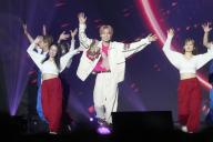 South Korean singer Lee Minhyuk performs on stage at Korean entertainment festival "KCON Japan 2024" held at Makuhari Messe in Chiba city, near Tokyo, on May 10, 2024. JIJI PRESS PHOTO \/ MORIO TAGA