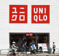The logos at a Uniqlo clothing store operated by Fast Retailing Co. in Tokyo, Japan, Tuesday, May 14, 2024. (Jiji Press/Naoki Ohashi