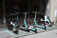 Micromobility devices including electric kick scooters rented out by Luup Inc. in Tokyo, Japan, Tuesday, May 14, 2024. (Jiji Press/Naoki Ohashi