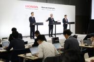 Honda Motor Co. President and CEO Toshihiro Mibe, back center, attends a press briefing in Tokyo, Japan, Thursday, May 16, 2024. Honda said Thursday it will invest about 10 trillion yen to promote the development and production of electric vehicles in the decade through fiscal 2030, double the amount the Japanese automaker earmarked under its previous plan in April 2022. (Jiji Press/Yudai Kato