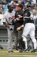 KRT SPORTS STORY SLUGGED: TIGERS-WHITESOX KRT PHOTOGRAPH BY JOHN LEE/CHICAGO TRIBUNE (May 1) CHICAGO, IL--  Home plate umpire Tony Randazzo and Sox catcher Chris Widger (36) try to stop Detroit