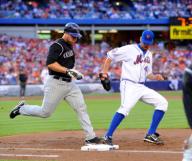 Colorado Rockies Christopher Ionetta is out at first by Texas Rangers pitcher Oliver Perez who covered first on a grounder in the second inning at Shea Stadium in Flushing, New York, on Friday, July 11, 2008. The Mets defeated the Rockies 2-1. (Paul J....