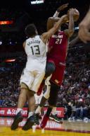 Miami Heat center Hassan Whiteside (21) is fouled by Milwaukee Bucks Malcolm Brogdon (13) in the second quarter on Sunday, Jan. 14, 2018 at the AmericanAirlines Arena in Miami, Fla. (Matias J. Ocner/Miami Herald/TNS)