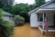 Receding flood waters surround a home in Whitesburg, Kentucky, on Friday, July 29, 2022. (Ryan C. Hermens/Lexington Herald-Leader/TNS