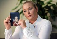 Virginia Roberts Giuffre, with a photo of herself as a teen, when she says she was abused by Jeffrey Epstein, Ghislaine Maxwell and Prince Andrew, among others. (Emily Michot/Miami Herald/TNS