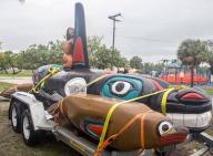 A hand-carved whale totem by artist Jewell James arrives at Virginia Key in Key Biscayne, Florida, on May 27, 2018. The Lummi Nation sent the totem pole from Seattle to create awareness and protest for the release of Lolita the killer whale from the Miami Seaquarium. Five years later, the Lummi Nation is preparing to take possession of the whale