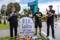 PETA organizer Amanda Brody leads a eulogy in front of volunteers, activists and media alongside a makeshift memorial during a vigil hosted by PETA for Lolita the killer whale, also known as Toki, outside Miami Seaquarium in Key Biscayne, Florida, on Saturday, Aug. 19, 2023. (D.A. Varela/Miami Herald/TNS