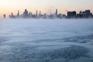 Morning sunrise over the city skyline and the steaming frigid waters of Lake Michigan at Montrose Beach on Jan. 16, 2024, in Chicago. (Antonio Perez/Chicago Tribune/TNS