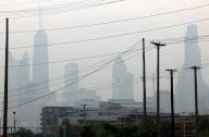 Chicago skyline and power lines along Halsted Street near Chicago Avenue, during the second straight day of hazy and poor air quality conditions on Wednesday, June 28, 2023. (Antonio Perez/Chicago Tribune/TNS