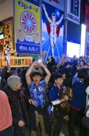 Japan supporters celebrate in Osaka\'s Dotonbori area in western Japan on Dec. 2, 2022, following Japan\'s come-from-behind win over Spain in a World Cup Group E football match in Doha, Qatar. Japan beat Spain 2-1 to advance to the round of 16. (Kyodo) ==Kyodo