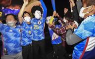 Fans wearing Samurai Blue shirts jump for joy at a public viewing event in Fuchu, Hiroshima Prefecture, western Japan, on Dec. 2, 2022, after Japan\'s comeback win over Spain in the football World Cup in Qatar. (Kyodo) ==Kyodo
