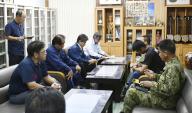 Photo taken on Aug. 24, 2023, in the Okinawa Prefecture town of Yonaguni, southern Japan, shows local officials and members of Japan
